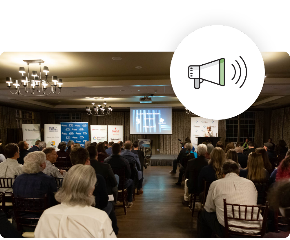 a conference full of people listening to a person on stage